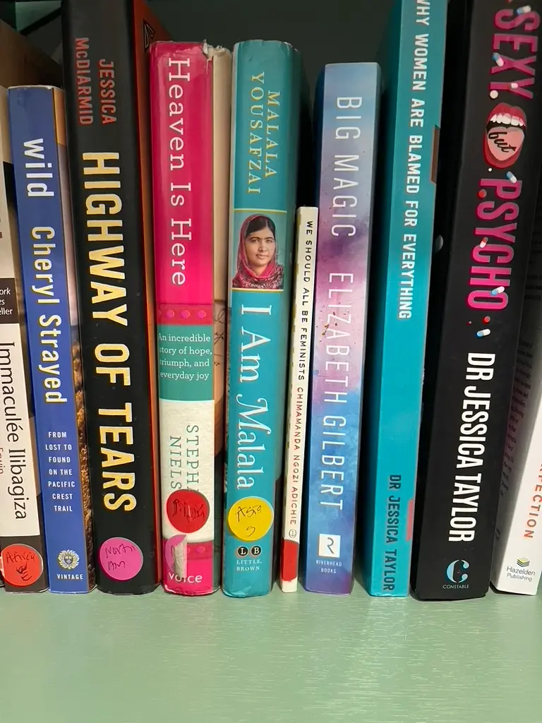 Feminist empowering books on a shelf.